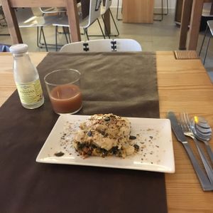 lasagne and apple juice  at La Rogeta Cuina Vegana in Valencia
