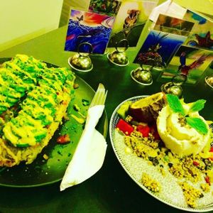 Brekky Boat: Toasted Spelt Bun Served open faced delectable cashew cheese, avocado & diced tomato. at Cheeky Yam in Cairns