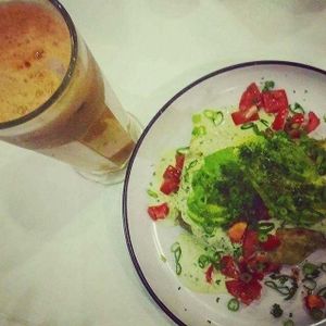 Smiling Buddha Juice and a Black Bean Burrito. at Cheeky Yam in Cairns