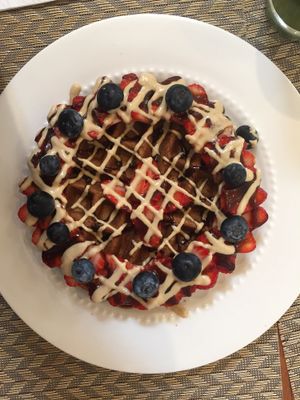 Waffles with strawberry, blueberry, vanilla cream, and coconut manjar  at Raw Cafe - La Molina in Lima