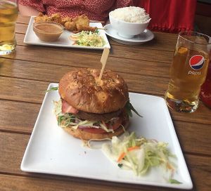 Vegan bacon burger and vegan skewers with peanut sauce at Papa No in Berlin