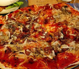 Pizza with Mushrooms and portuguese sausage at Green Beans in Lisbon