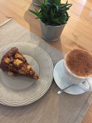 Apple and nut cake straight out of the oven, with a cappuccino  at Green Beans in Lisbon