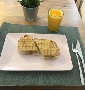 Salami + Cheese toast with a fresh Orang Juice at Green Beans in Lisbon