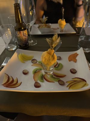 Thin sliced fruits with vegan ice cream  at Olives Restaurante in Funchal