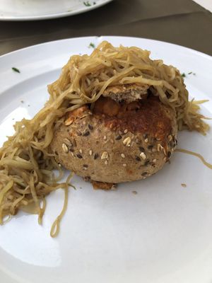 Crispy seeded bread filled with a chickpeas  at Olives Restaurante in Funchal