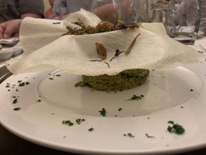 Vegetables binded with chickpeas, topped with wafer and wok vegetables at Olives Restaurante in Funchal