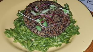 pesto pasta with quinoa burger at Armonica Cafe in Lima