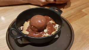 Cookie dough cake served with vegan icecream and choc sauce 😍 at Armonica Cafe in Lima