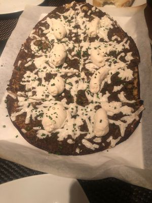 Truffle pizza not on vegan menu. Its on pizza section , delicious.  at Wynn Hotel - Allegro in Las Vegas