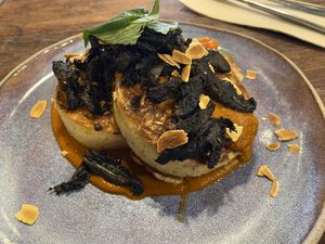 Sourdough crumpets with bush tomato curry  at Two Chaps in Marrickville