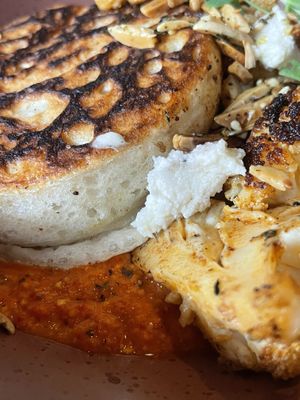 Crumpet with capsicum cream vegan feta and almonds    at Two Chaps in Marrickville