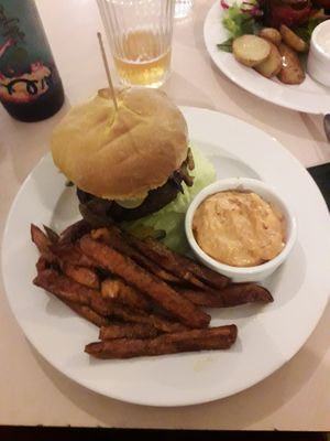 Seitan burger with fries at Terapija in Riga