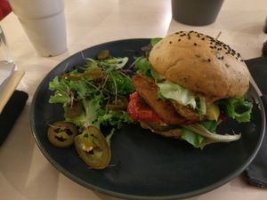 Tempeh burger (without the mayo, with burger sauce) + jalapenos + cheese. at Terapija in Riga