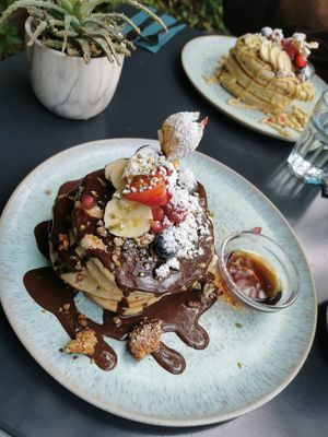 Pancakes with Chocolate Sirup, Fruits, Granola and Maple Sirup at Emmi's Kitchen - Glockenbach in Munich