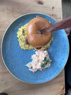 Breakfast burger with coleslaw  at Emmi's Kitchen - Glockenbach in Munich