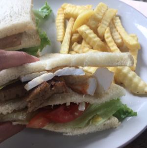 club sandwich! with mock pork, prawns, and squid.  at Bali Maitreya Cafe in Lembongan
