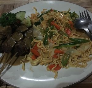 Fried noodles with "chicken" satay. at Bali Maitreya Cafe in Lembongan