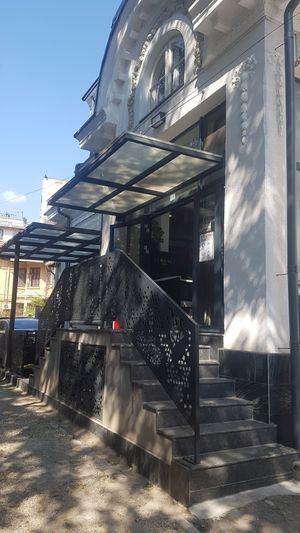 front,the second door is the entry at Rawyal Brunch & Cakes in Bucharest