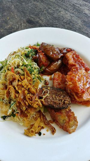 from the buffet; aubergine, tempe/tofu, Balinese "sausage", "fish", "chicken", stirfry vermicelli, veg stirfried with shredded coconut at Trihita Vegan in Dalung