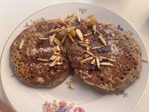 Buckwheat pancakes with date syrup, almonds, coconut and seasonal jam  at Hofi Cas Cora in Willemstad