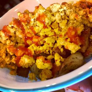 Southwestern tofu scramble with homemade potatoes, served with black beans and rice  at SunShine Cafe - Front St in Keyport