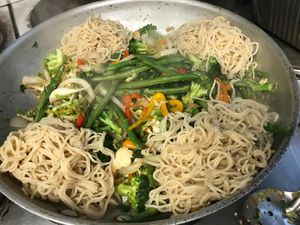 Ramen noodle bowl for 4: fresh sautéed vegetables, brown rice sesame ramen noodles served with crispy cauliflower with a little kick!😍 at SunShine Cafe - Front St in Keyport