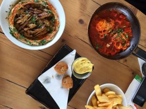 hummus with vegan shumbara, vegan bitterballen (we couldn't wait) plus the roasted pepper egg dish   at Traffic in Amsterdam