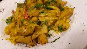 vegan chicken with fried vegetables chickpeas in turmeric sauce and rice  at Traffic in Amsterdam