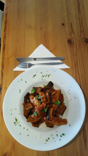 vegan chicken with eggplant in piquant tomato sauce & rice  at Traffic in Amsterdam