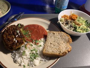 Stuffed pepper main entree with side salads   at Madglad Cafeteria in Copenhagen