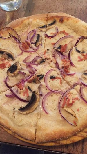 Pizza carbonara at Pura Vida Vegan Bar in Madrid