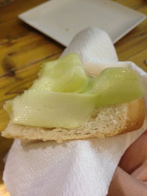 Tapa of bread with thinly sliced zucchini  at Pura Vida Vegan Bar in Madrid
