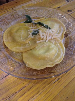 Avocado-stuffed ravioli with sage butter and vegan parmesan  at Pura Vida Vegan Bar in Madrid