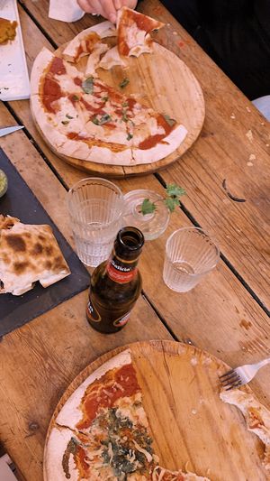 Pizza margarita. Burrito. Y pizza 4 quesos  at Pura Vida Vegan Bar in Madrid