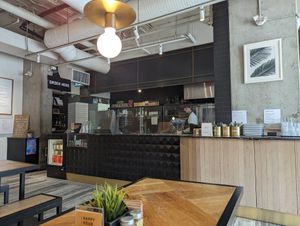 Three long bench tables provide interior seating at Virtuous Pie  in Vancouver