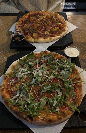 Hawaiian summer (far) and Sgt. Pepperoni (near)  at Virtuous Pie  in Vancouver