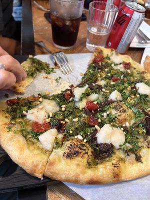 Ultraviolet pizza with walnut pesto, cashew mozzarella, tomato and caramelized onions   at Virtuous Pie  in Vancouver