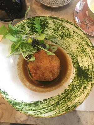 Inlander (filled with pineapple and something that tastes like salmon, on top of some kind of potato pancake) spinach and salad are more decor than actually part of the dish  at 26 Vegan Food Project in Lisbon