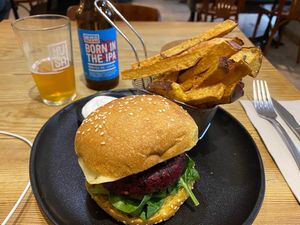'PROHIBITED' burger €14 - Black rice burger with spinach,
barbecue sauce, red onion jelly, smoked tempeh and
caramelised pineapple,
sweet potato fries and mayo.  at 26 Vegan Food Project in Lisbon