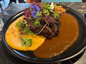 Mushroom dish (lots of them!) with sauces, salad with drizzle of raspberry dressing at 26 Vegan Food Project in Lisbon