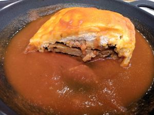 Cutted Francesinha, you can see the Saitan inside, on top some baked cheese, super yummy at 26 Vegan Food Project in Lisbon