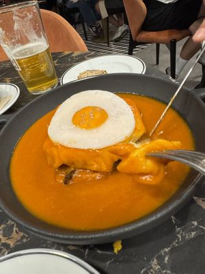 Francesinha with fried “egg"  at 26 Vegan Food Project in Lisbon