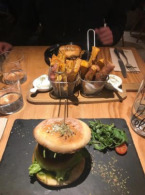 Bloody beet burger, sweet potato chips with vegan mayo and seitan sandwich in the back! at 26 Vegan Food Project in Lisbon