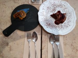 Delicious dessert. Orange cheesecake made with raw ingredients and chocolate cake with berry cover at 26 Vegan Food Project in Lisbon