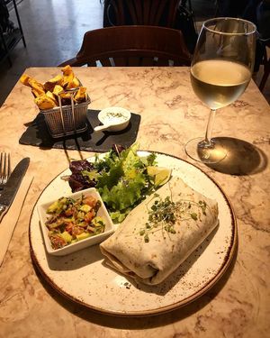 Daily menu: black bean burrito with brown rice and cilantro, guacamole and green salad + sweet potato chips. at 26 Vegan Food Project in Lisbon