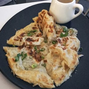 roti with a curry dressing at Kindness Vegan in Darlinghurst