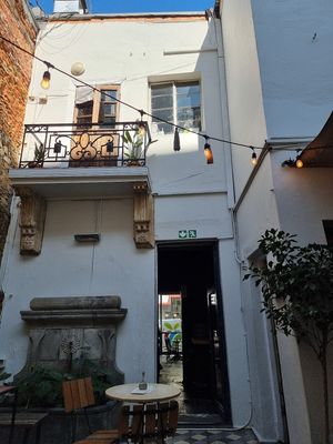 Outdoor hidden away seating area in the cafe. at Honest Chocolate Shop in Cape Town