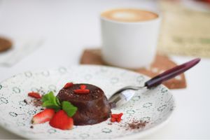 Capuccino with almond milk and tasty raw dessert  at Groot in Moscow