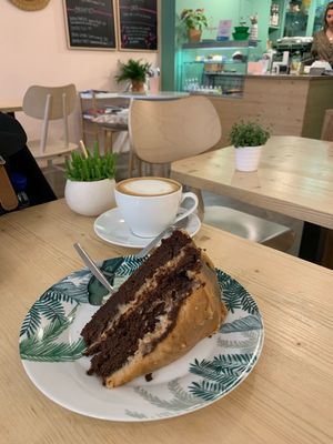 Chocolate peanut butter cake and oat latte. Over indulgence! 😍 at Flowers Kitchen in Luxembourg City